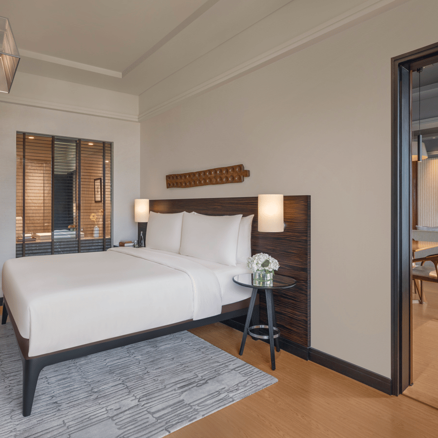 Bedroom with a double bed and attached sitting area at The Raintree, St. Mary’s Road.