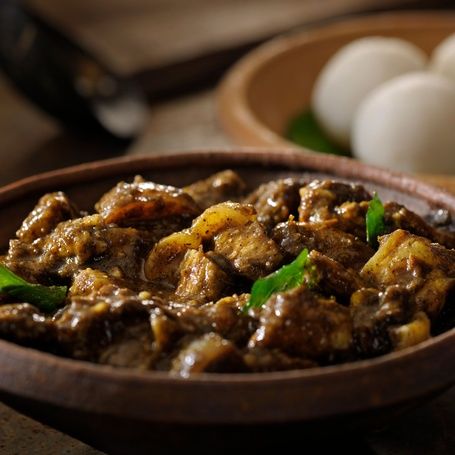Coorg Pandi Curry with Kadambattu (rice balls).