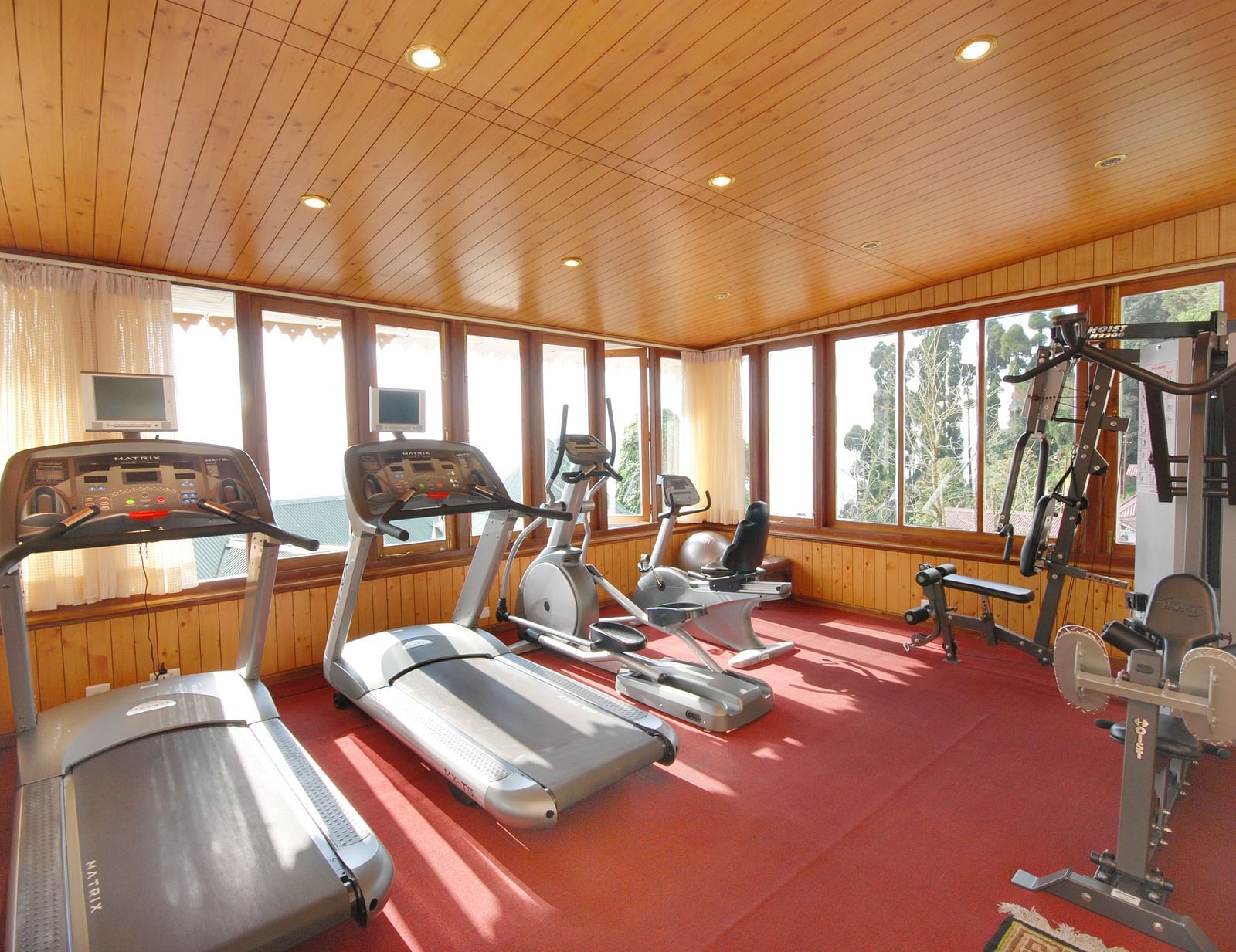 treadmill and other equipment in the gym - Mayfair Hill Resort, Darjeeling 