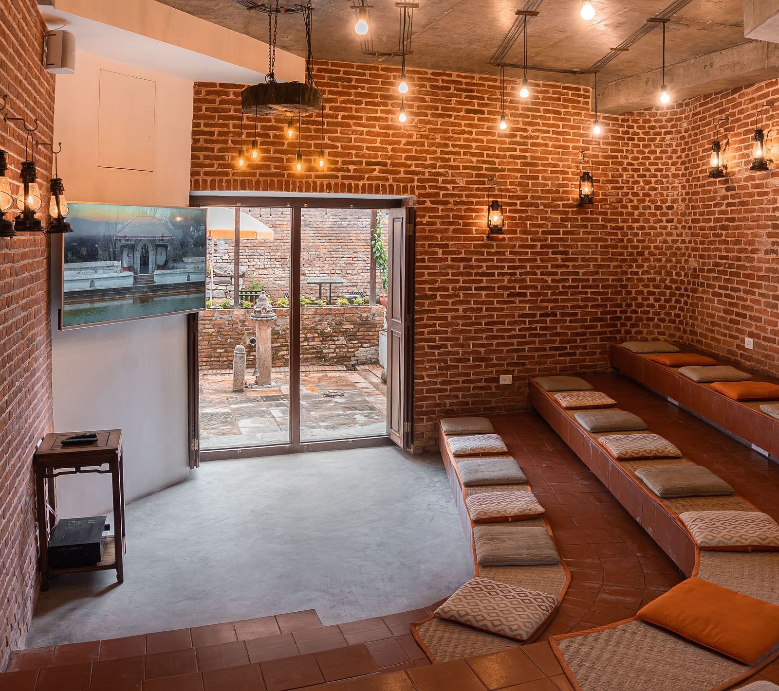 A seating area beautifully decorated with subtle lights - The Nanee