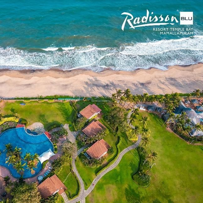 Panoramic view of pool and beach for corporate retreats - Radisson Blu Resort, Temple Bay Mamallapuram