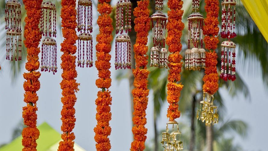 flowers being hung for a wedding event at Caravela Beach Resort, Goa
