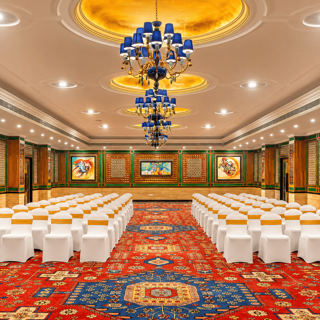 Orchid Hall banquet setup with ornate chandeliers at Mayfair Oasis Resort, Jharsuguda