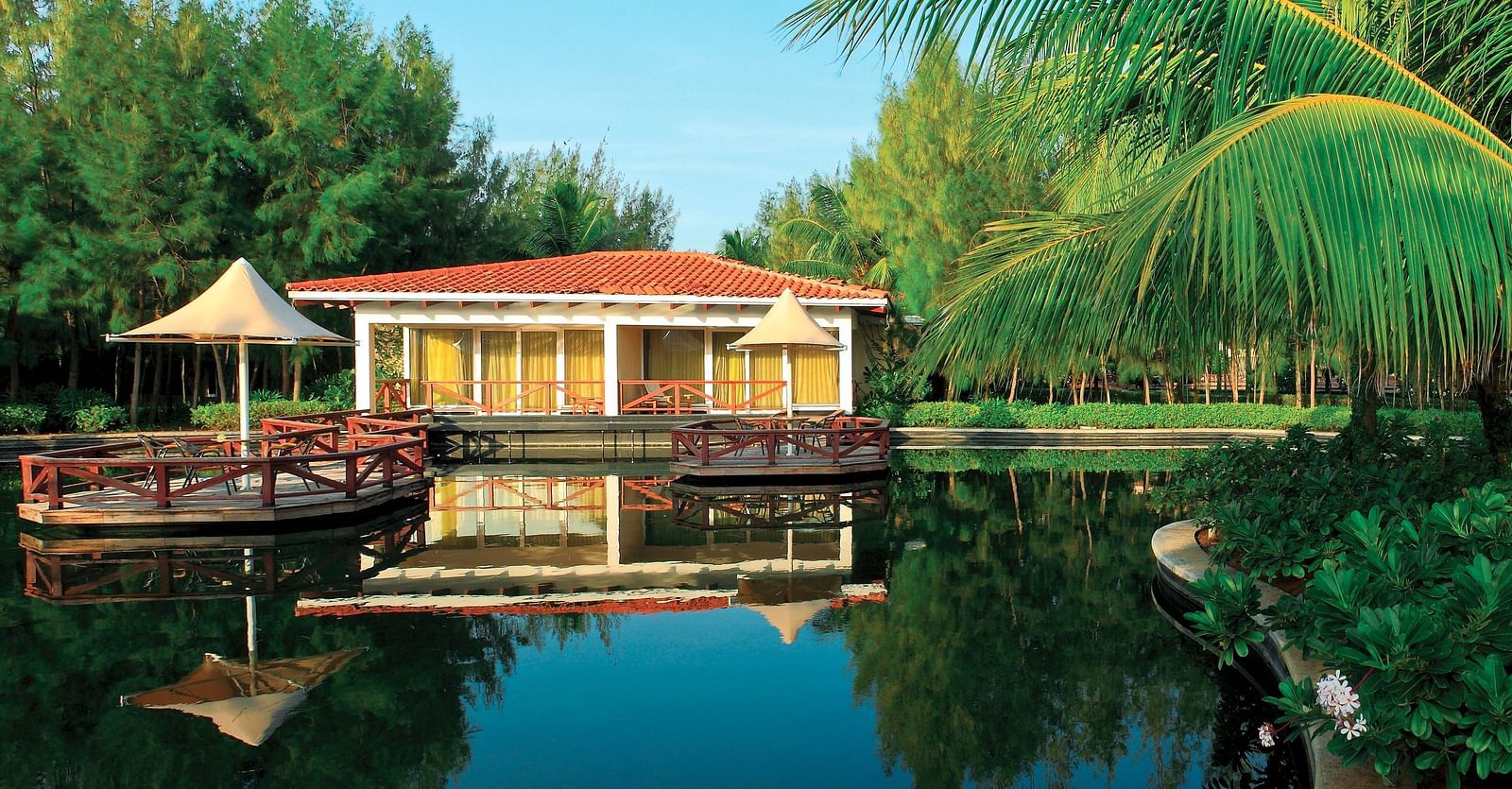 Bermuda Exterior with Deck in front of a lake at Ocean Spray, Pondicherry