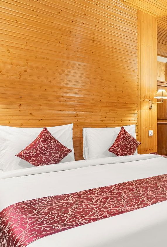 Image of a room with bed and sitting area at at Summit Tashi Ghang Heritage Resort, Pelling