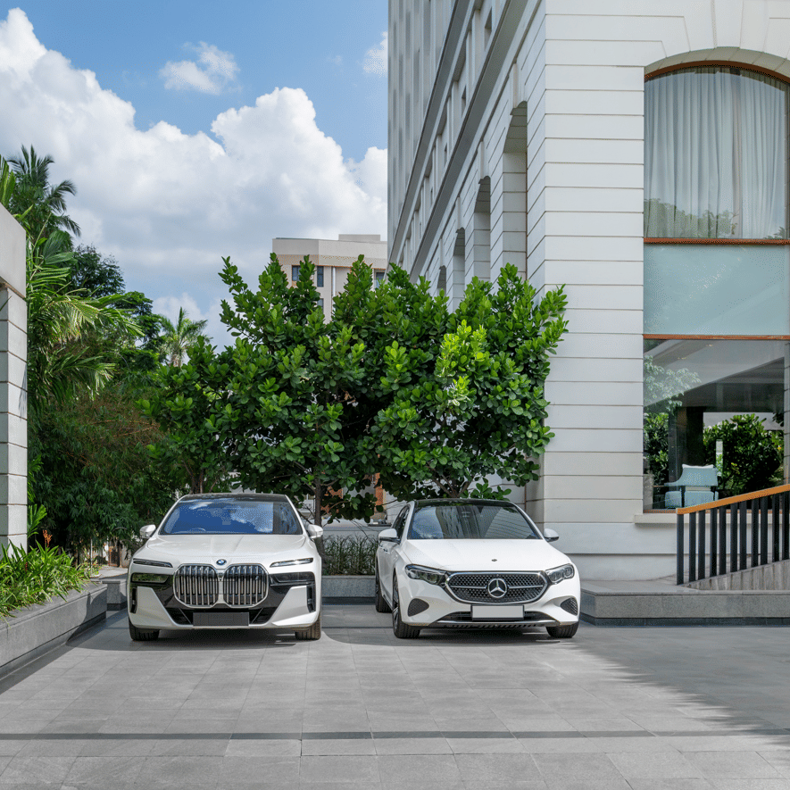 Hotel driveway with parked cars and building exterior at The Raintree, St. Mary’s Road.