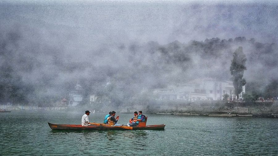 a group of people boating in a lake