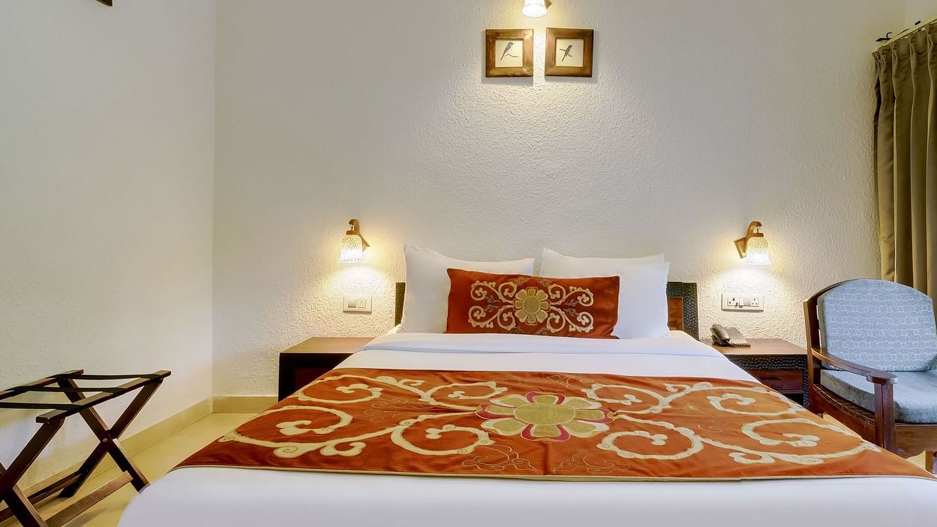 Image of a room with bed and sitting area at Summit By The Ganges Beach Resort & Spa, Rishikesh