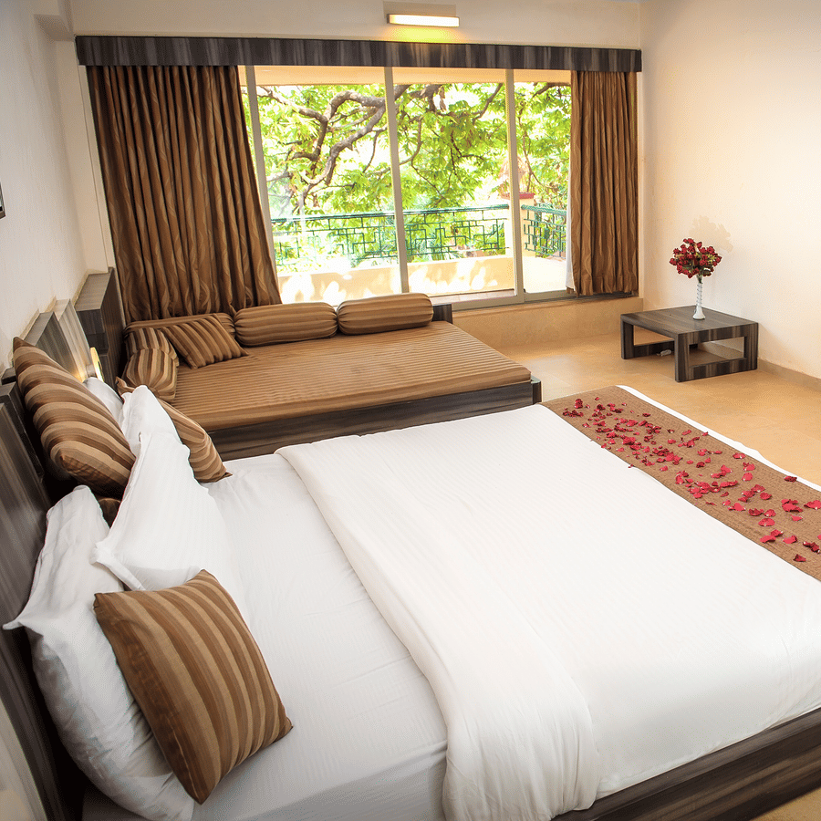 A view of the bed beside the window in Regency Room.