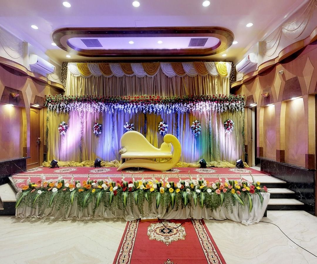 View of a brightly lit stage for a wedding occasion in Sammilan Hall