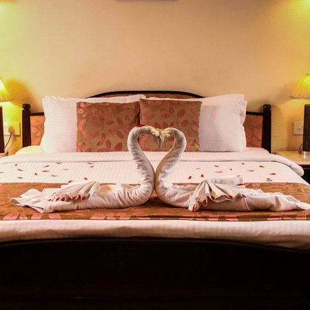 a beautifully decorated towel kept on the bed of the presidential suite - Polo Towers, Shillong