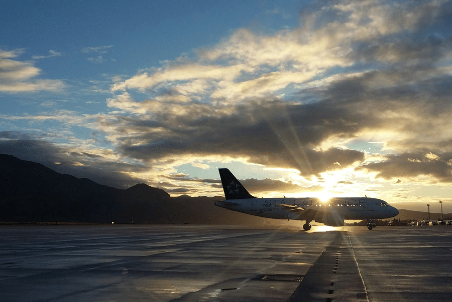 A silhouette of an aircraft parked on the runway.