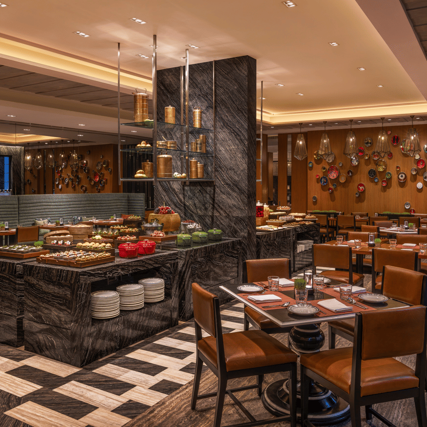 Restaurant with dining tables and buffet counter at The Raintree, St. Mary’s Road.