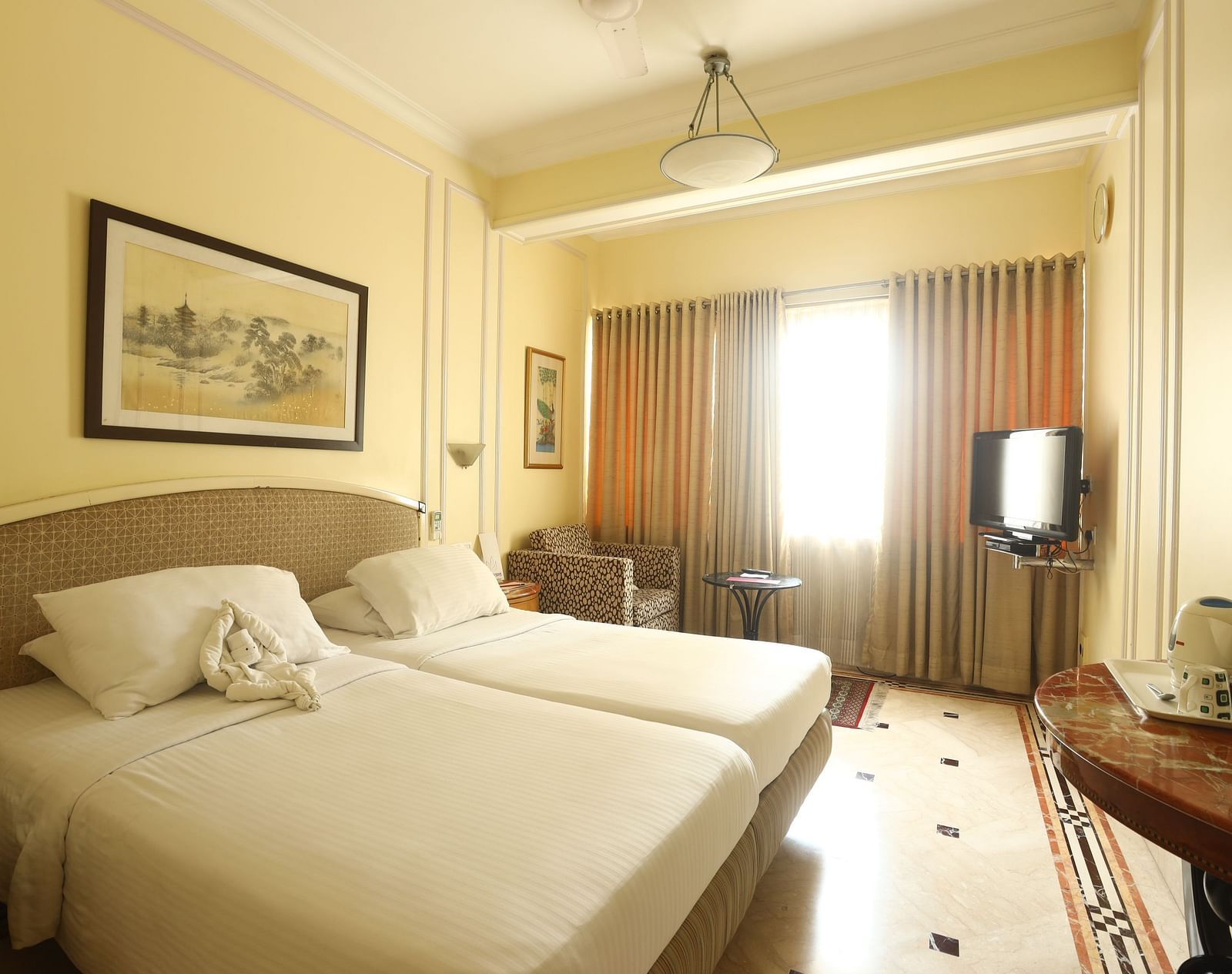 Twin beds in the Standard Room at Regency Hotel, Mumbai.