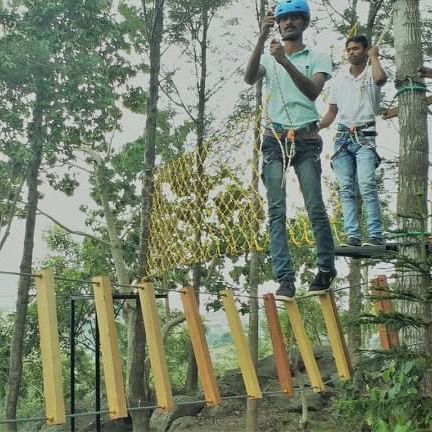 Image of the Slide Walk Bridge with an instructe=or and an guest on it at grand palace yercaud