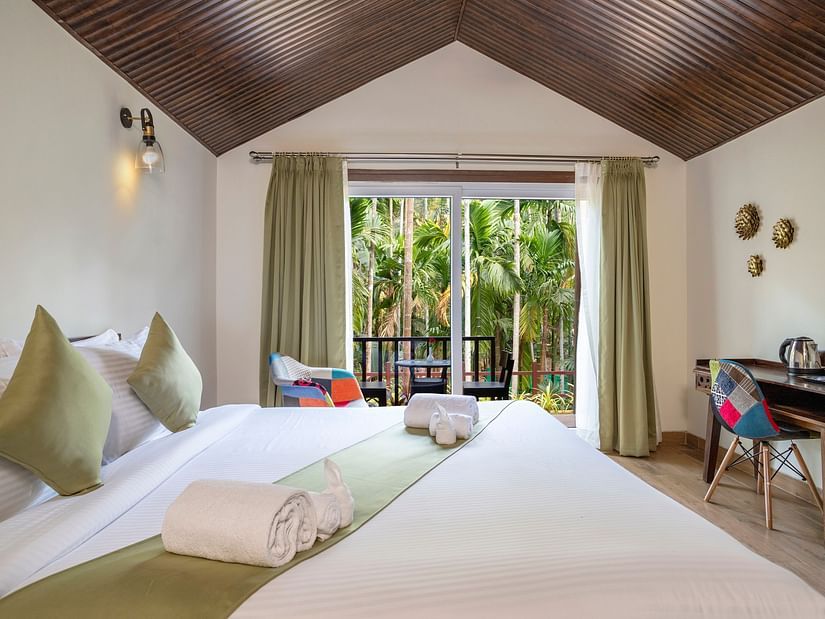 A view of our cottages with a view of the garden seen from the inside - Stone Wood Nature Resort, Gokarna
