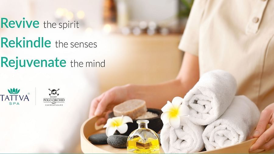a banner for spa with a woman bringing folded spa towels