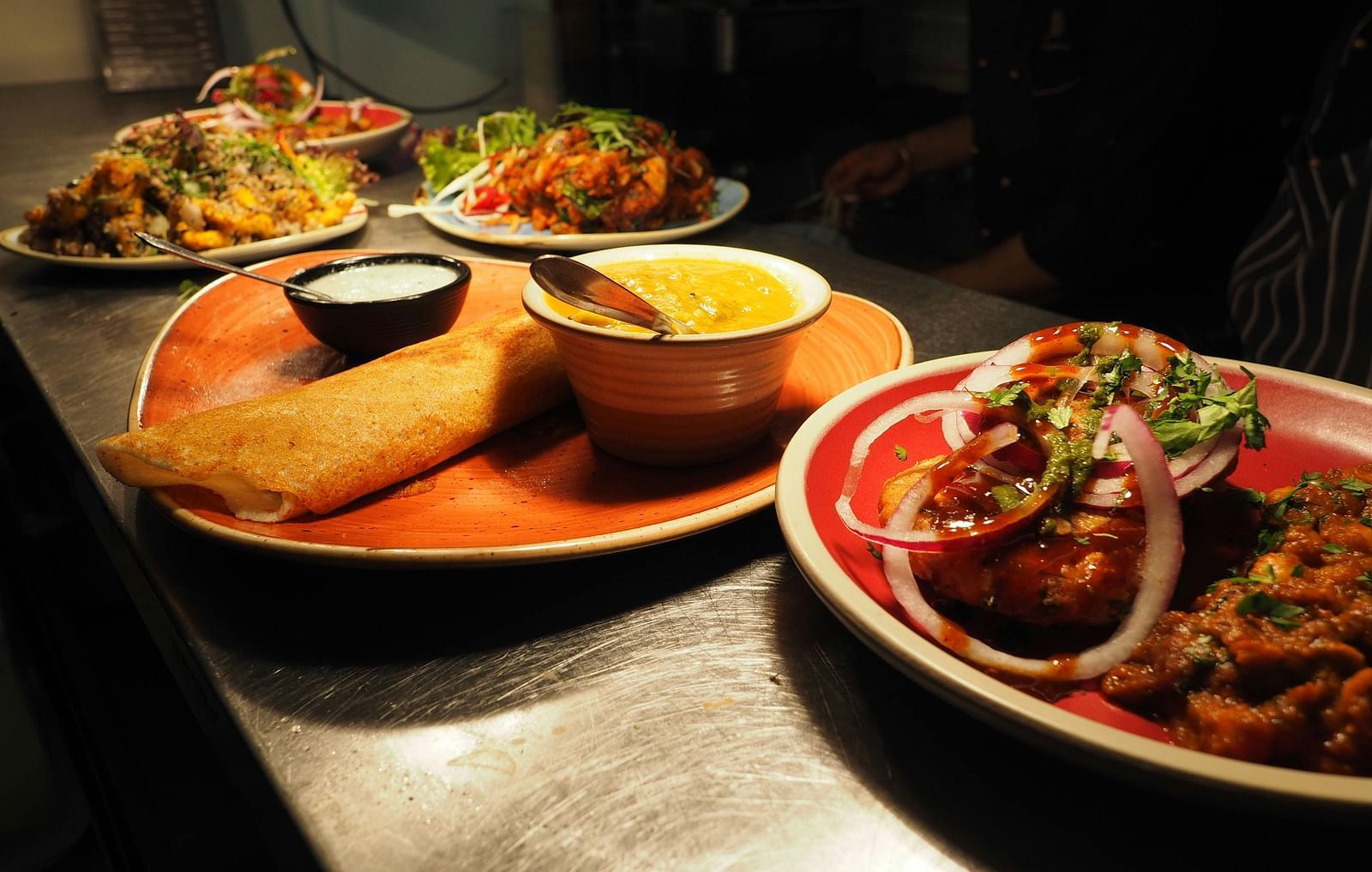View of food served on various plates in a restaurant. 