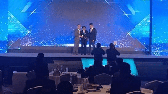 Stage setup with performers and blue lighting at Central Hotels event venue