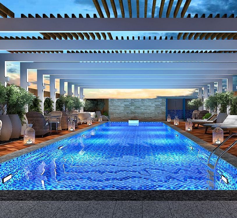 Rooftop outdoor swimming pool in Kinshasa at Kertel Suites with a shade over it