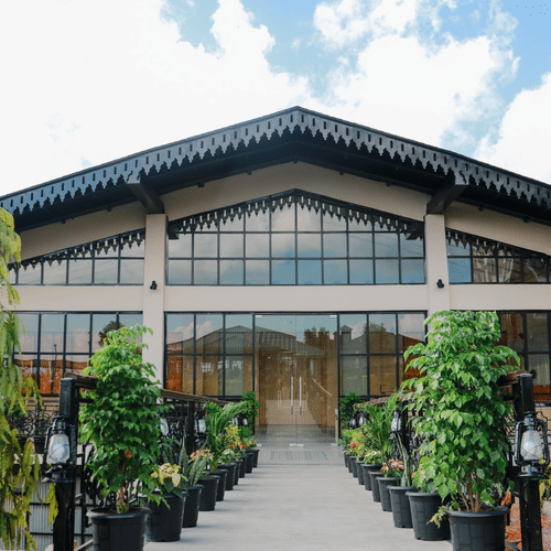 View of Mausmai Ballroom with a grid-structured glass façade, flooding the space with natural light and offering stunning outdoor views