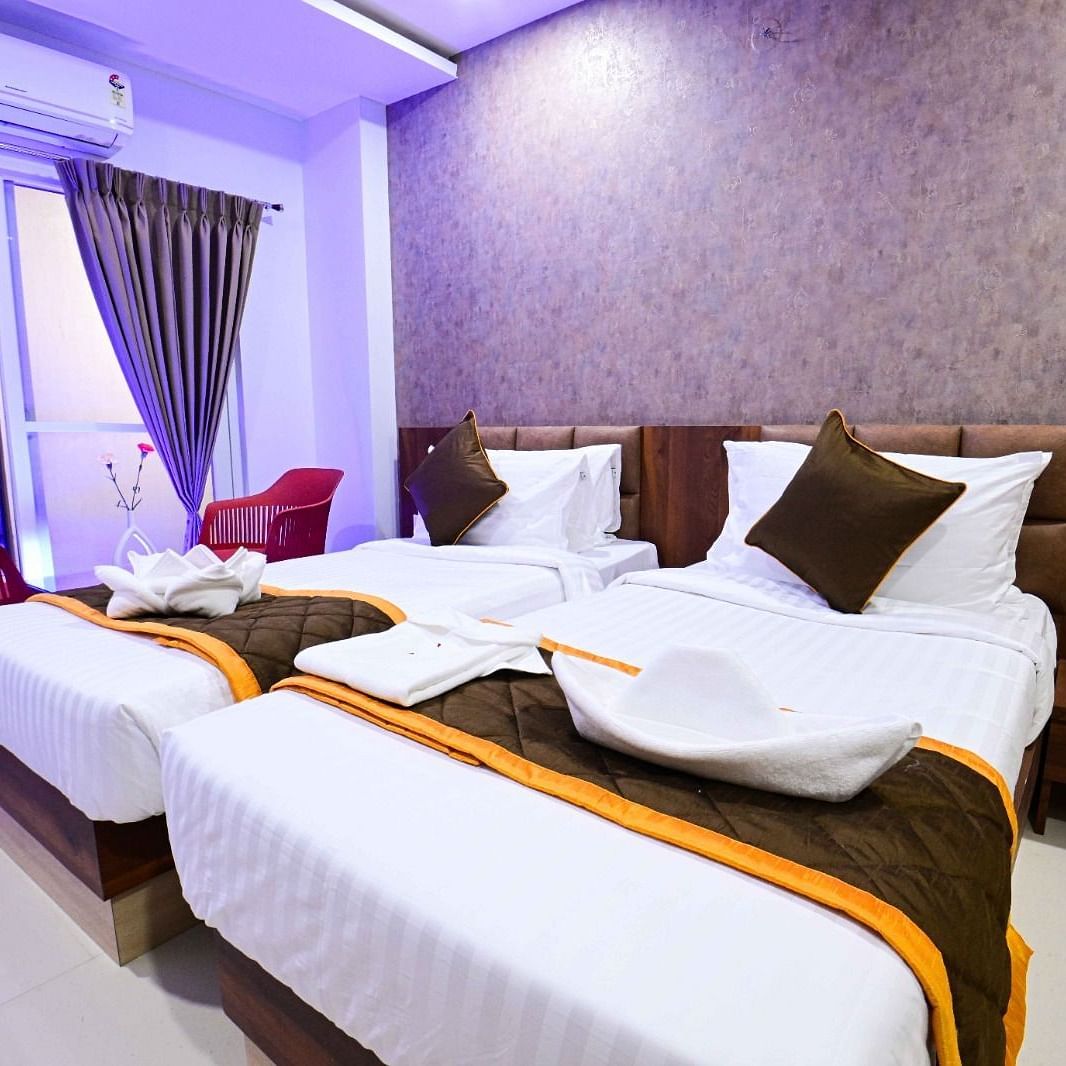 view of the twin beds of Twin Deluxe Room at South Square Hotel, Bengaluru
