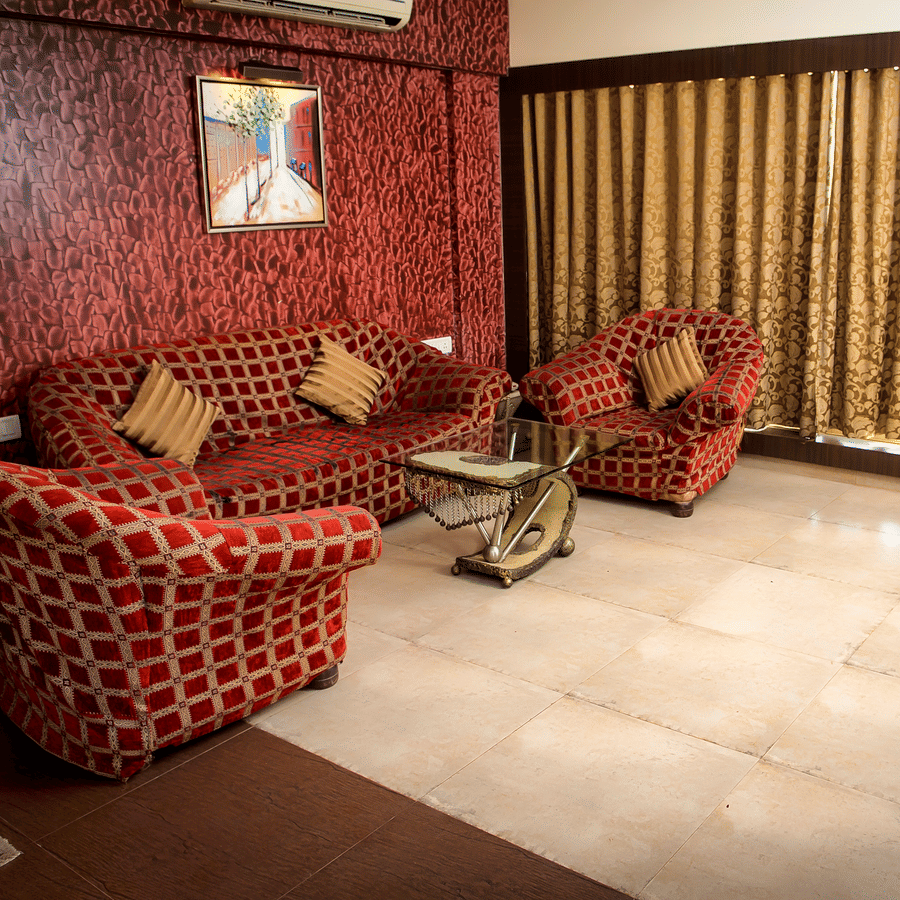 Royal Suite living area featuring sofas and a big widow.
