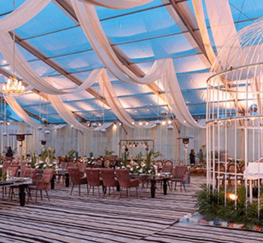Indoor seating arrangement in a banquet hall at Nirvana Luxury Hotel, Ludhiana