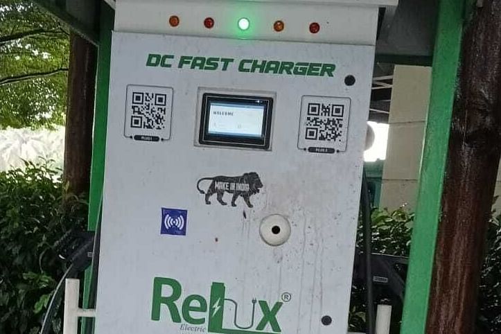 EV Charger pointer amidst the forest area. 