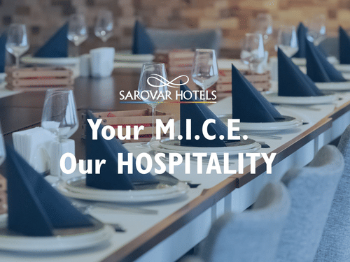 Sarovar Hotels & Resorts banner with the text Your MICE, Our Hospitality over a well-arranged dining setup in the background