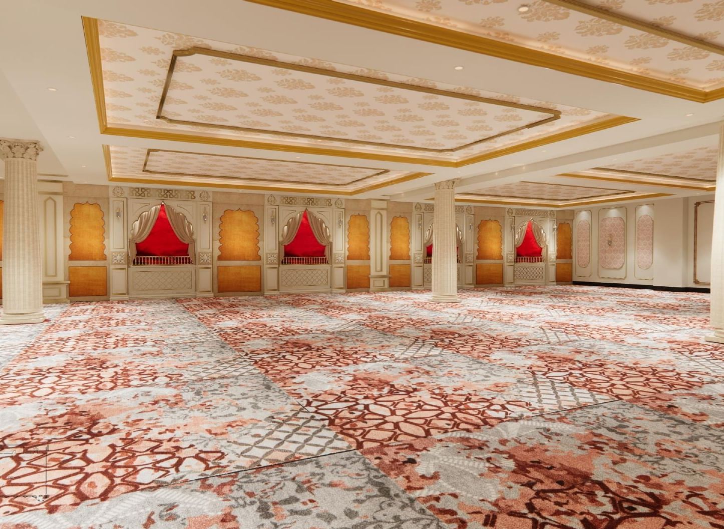 Grand banquet hall with elegant ceilings featuring floral motifs, large pillars, ambient lighting, and walls styled like traditional Indian windows.