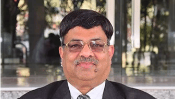 Pushpendra Bansal, COO of Lords Hotels & Resorts, quoted on Gujarat expansion. Image is a headshot of Bansal in a suit.