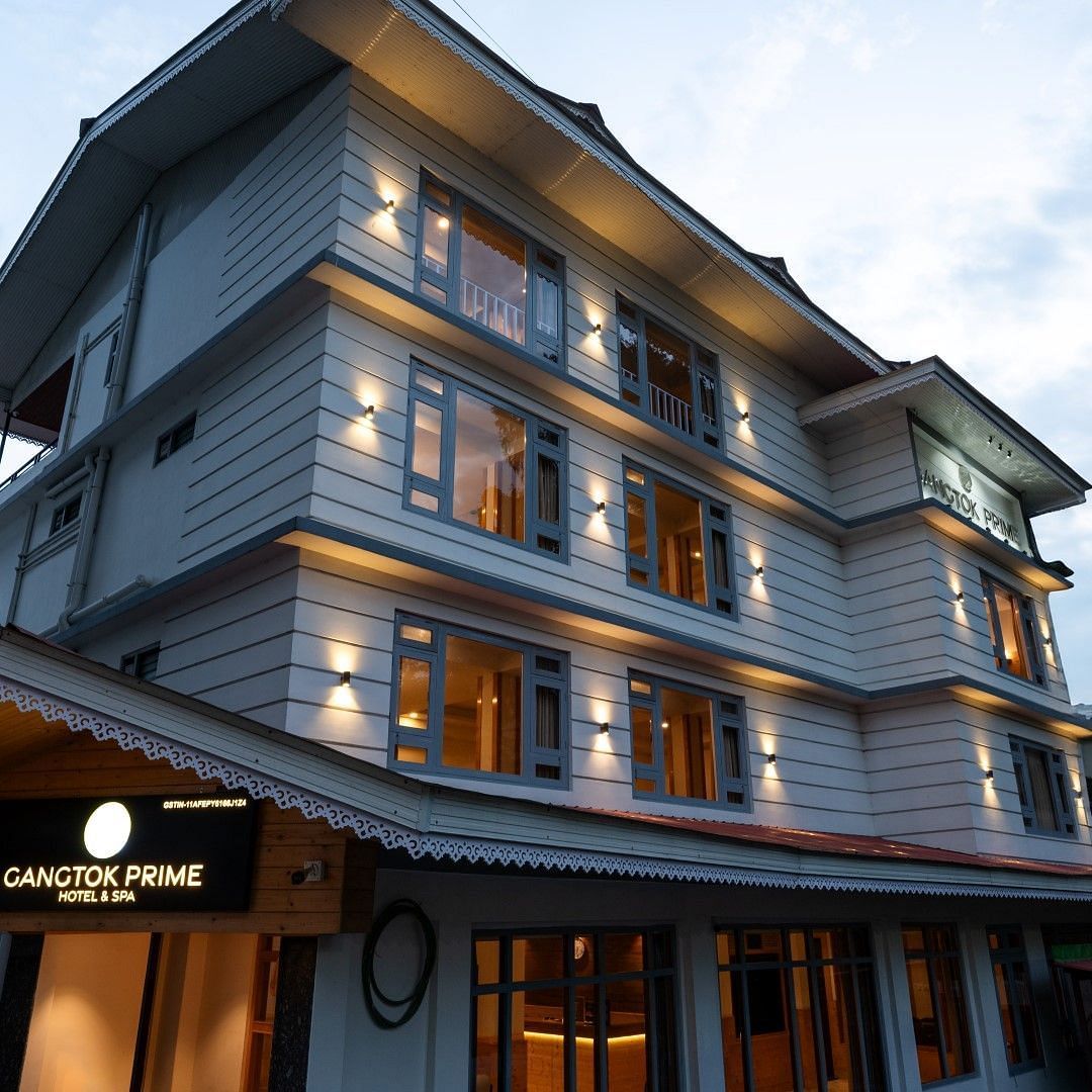 An image of a three storey building and there's also a sky in the background - Avianna Group of Hotels & Resorts