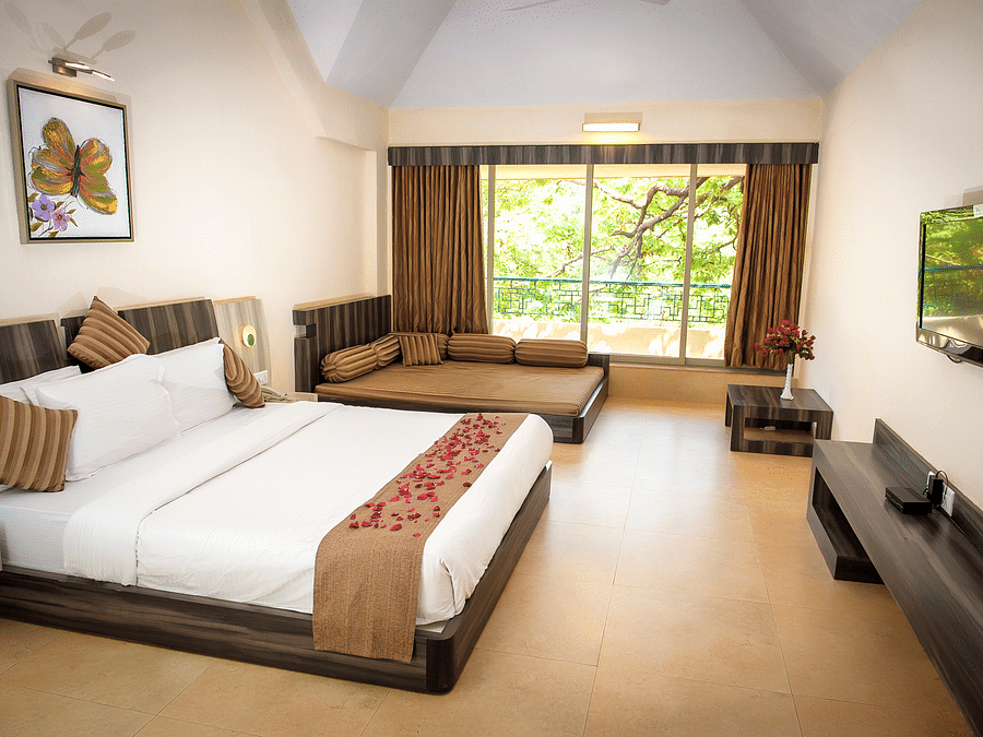 Adamo Resort Matheran - A close up view of the bed in Regency Room