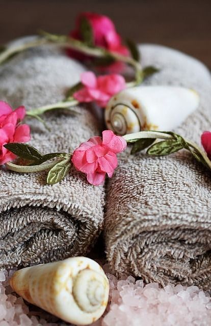 Image of towels with flowers on top of it