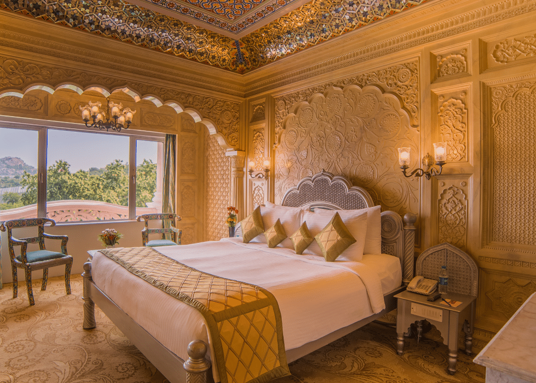 Room at Sitara Luxury Hotel in Hyderabad near Ramoji Film City with a double bed and side tables