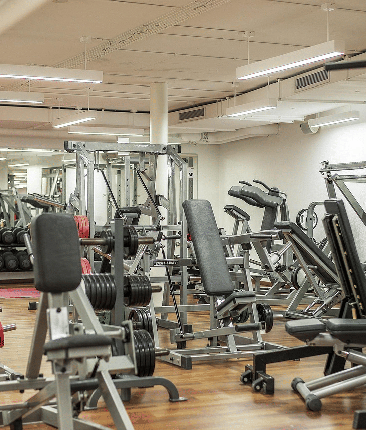 A well-equipped modern gymnasium with various exercise machines
