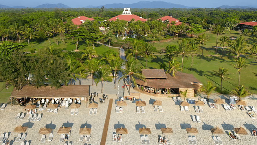 Aerial beach and property view of Caravela Beach resort with the arabian sea in the background