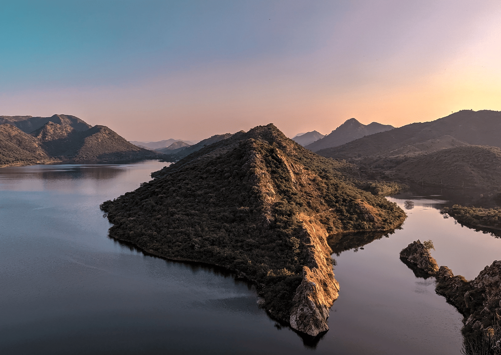 Dramatic sunset over Bahubali Hills and the surrounding mountain ranges of Badi Lake.