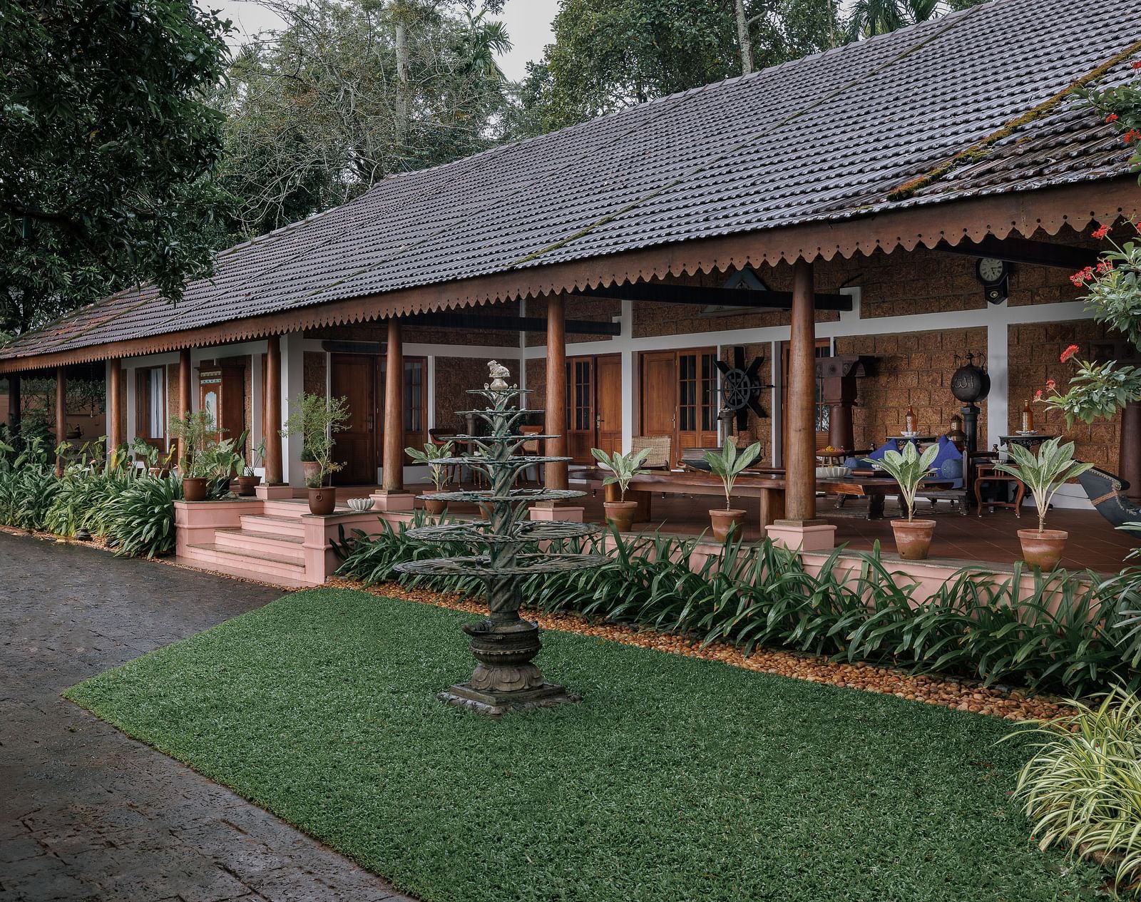 A facade of BluSalzz Villas - Muhamma Resort, Alleppey featuring the villas and greenery around it
