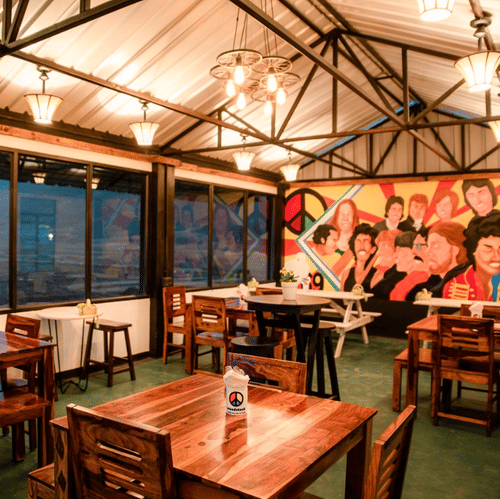 A warmly lit dining space with view of the outdoors in Woodstock resort