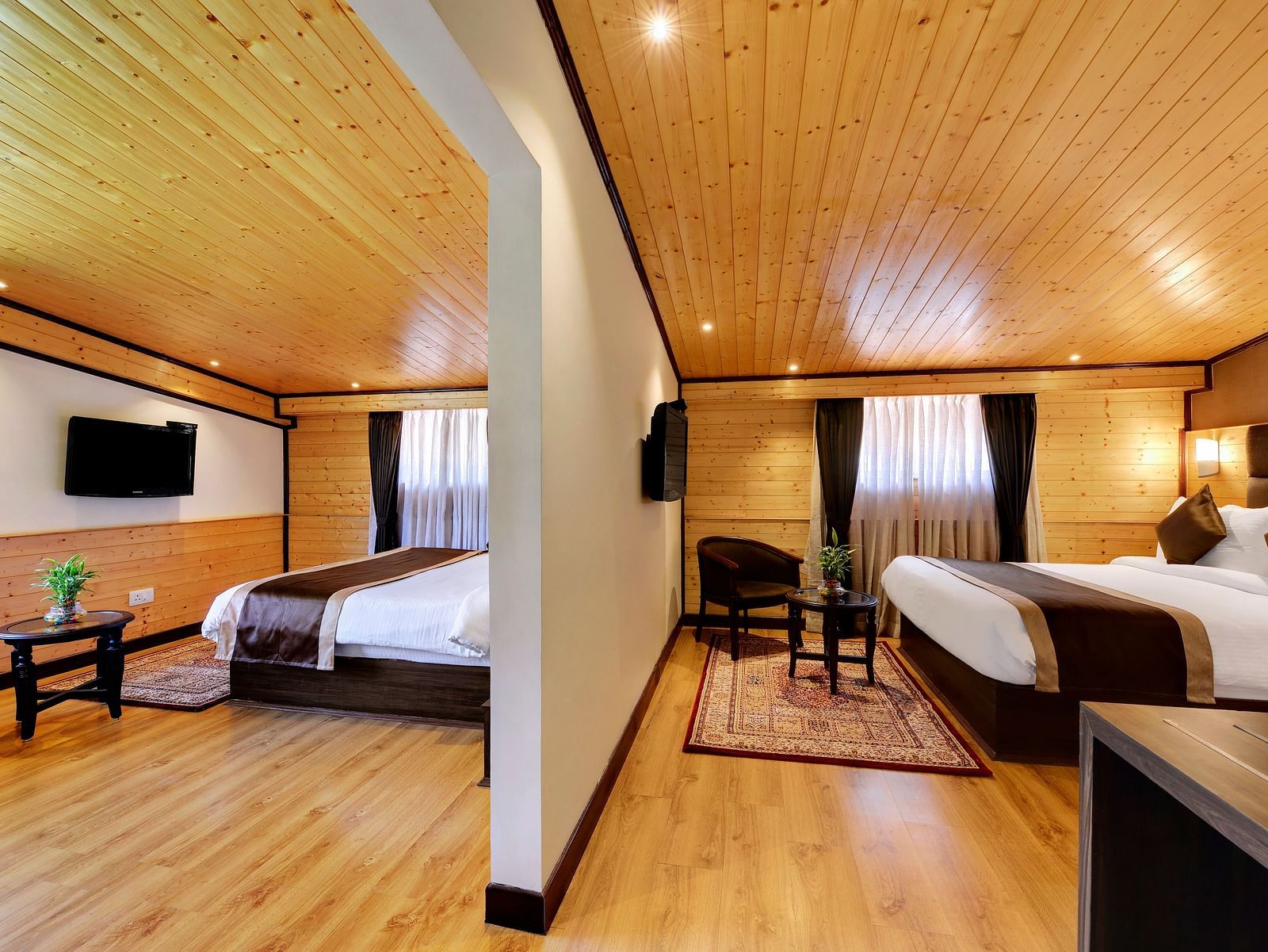 Queen beds in either side of the wall inside Attic family room - Sumitel Shangrila, Deorali