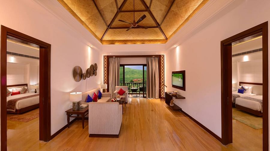 The living room with sofa, TV and coffee table in grand suite - The Ananta Udaipur