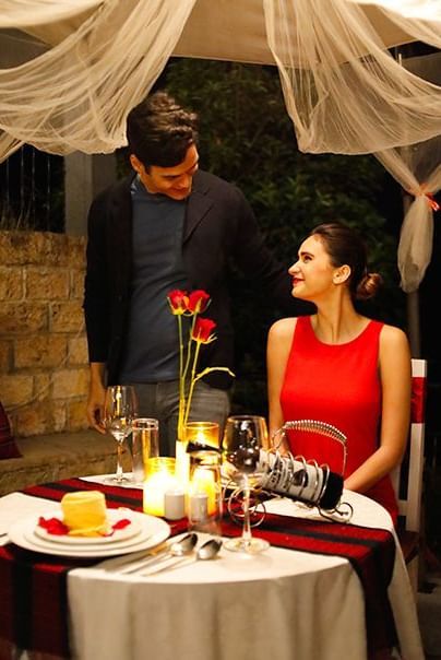 Candlelight dinner setup with two people seated at Polo Resort Cherrapunjee.