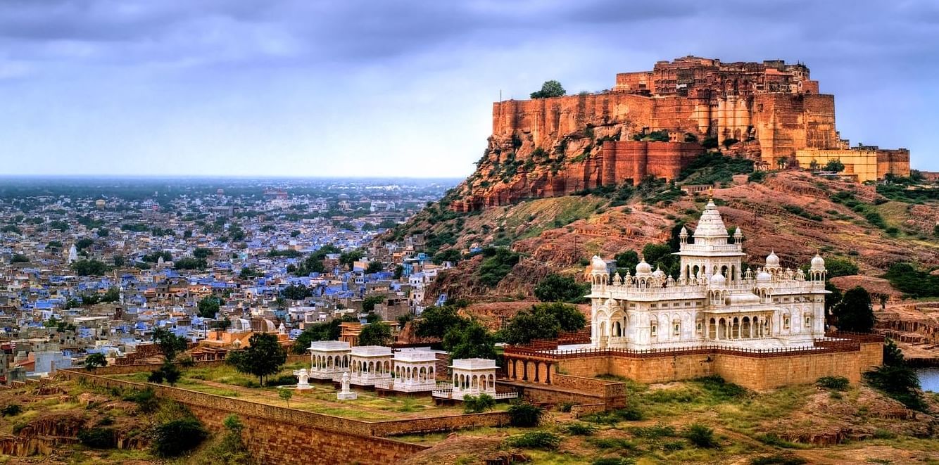 A panoramic view of Jodhpur, India, showcasing Mehrangarh Fort perched majestically on a hill overlooking the city.