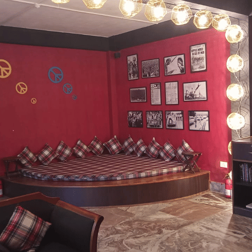 A living space with a round bedlike seating area at the corner