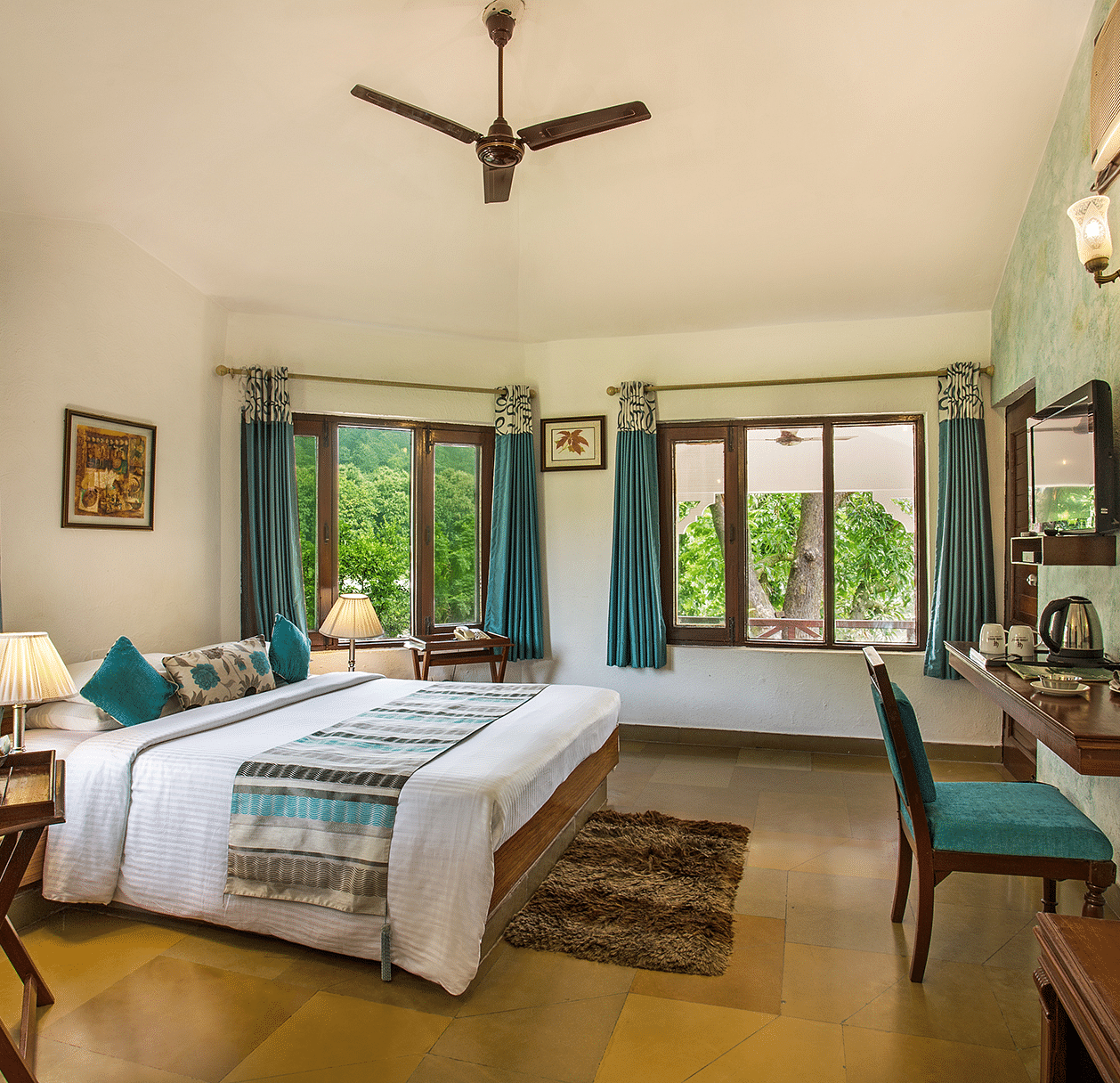 An image of a bedroom with king size bed, wooden ceiling where a fan is hanged,  cabinet and tables, etc. - The Riverview Retreat, Corbett