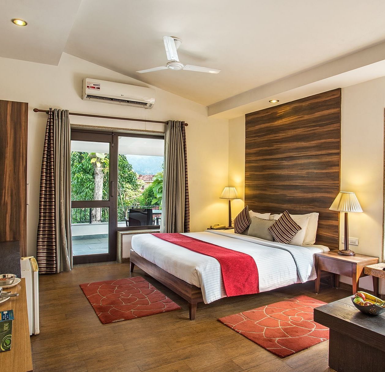 An image of bedroom with king size bed, flat TV screen, a fan, AC, a table cabinet, etc. - The Riverview Retreat, Corbett