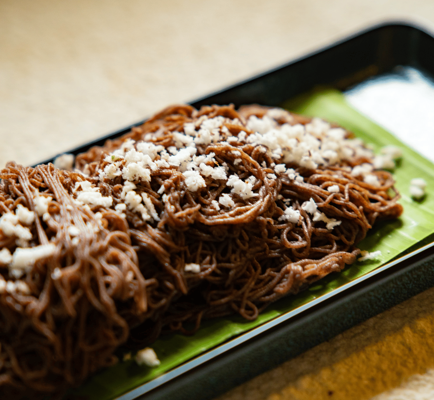 A close-up of folded pieces of flatbread on a banana leaf at Stanley Revelation.