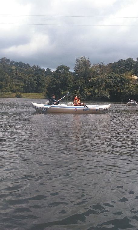 View of a lake showing beautiful waters, boating activities with greenary all around